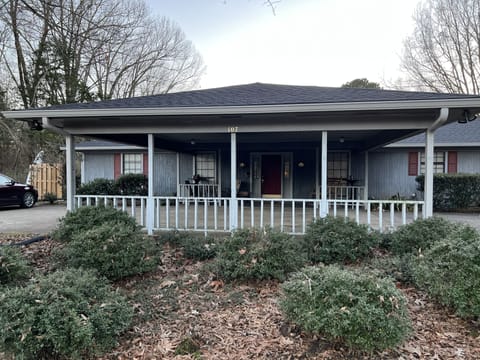 Carport w/covered spaces for 4 cars connects to front porch; Provides lake view.