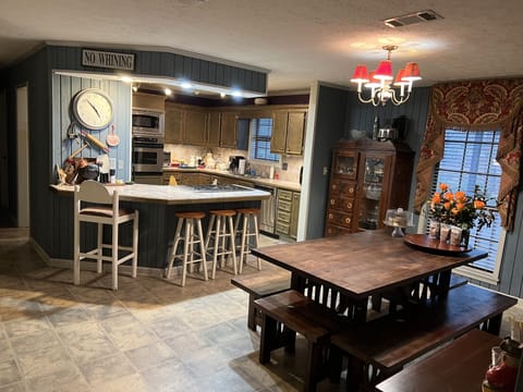 Dining room and kitchen open to the living area.