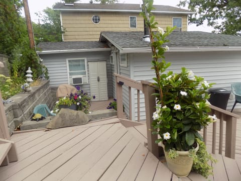 The cottage entrance with a propane grill available for your use.