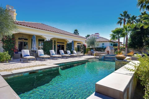 Welcome to Legends! Private, resort-style backyard with fireplace, custom BBQ island, ample seating and al fresco dining.