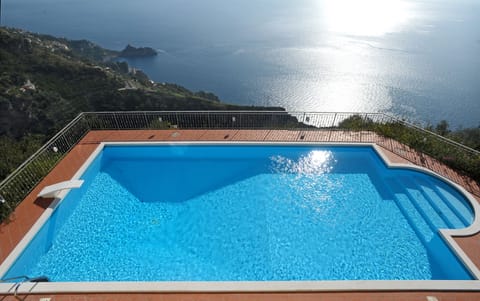 The wonderful pool with open views of coast and sea