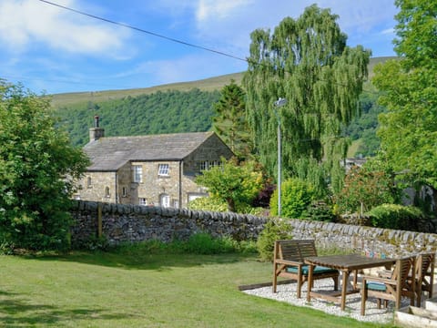 Lawned garden with wonderful views of the surrounding area | Wellside Cottage, Starbotton, near Kettlewell