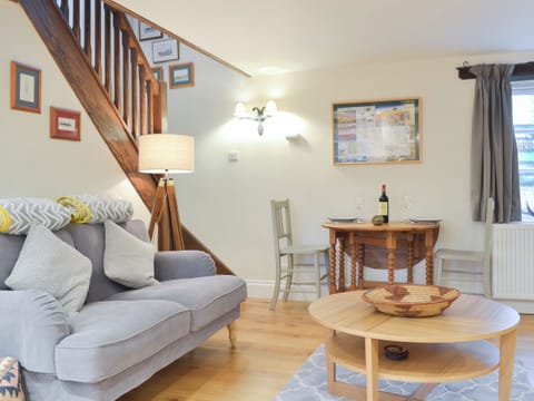 Comfortable living area and open staircase | Stables End, Stickle Path, near Watchet