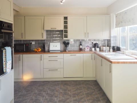 Kitchen with breakfast area | Waggy Tails, Seahouses, near Alnwick
