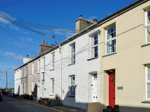 Charming holiday home (white property to the left of the red door) | Seadrift, New Quay