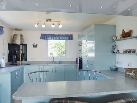 Bright modern kitchen with breakfast bar | Seascape, Hilton, near Tain