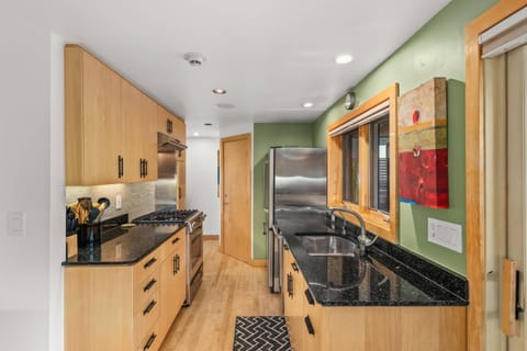 Stainless steel appliances, granite countertops, and a great view are found in the fully equipped kitchen of this condo.