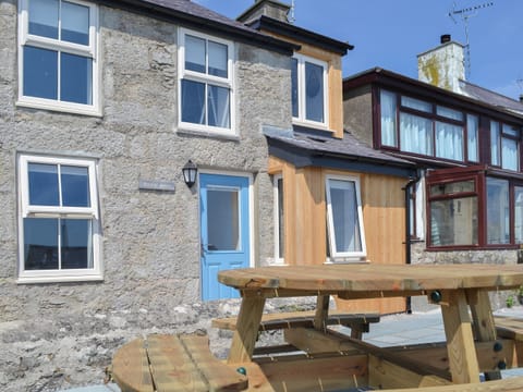 Picnic style seating area outside the property | Bryn Awel, Moelfre, near Benllech