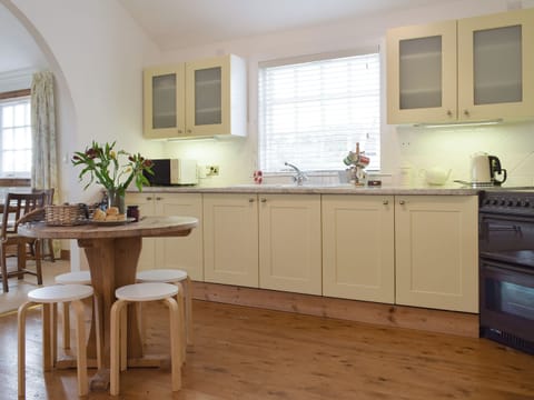 Well-equipped kitchen with informal dining area | Lucklaw Steading Cottage, Balmullo, near St Andrews