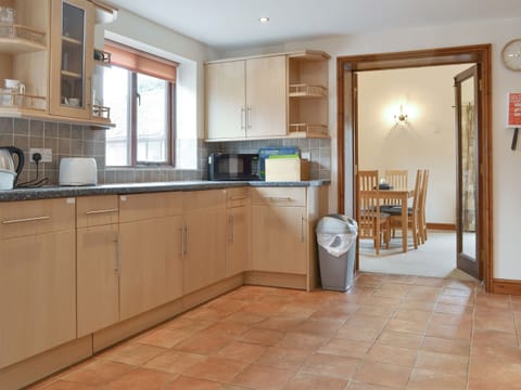 Well-equipped fitted kitchen | Dairy Cottage - Moor Farm Stable Cottages, Foxley, near Fakenham