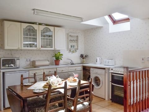 Well-equipped fitted kitchen with dining area | Low Cordorcan - Cordorcan Cottages, Wood of Cree, near Newton Stewart