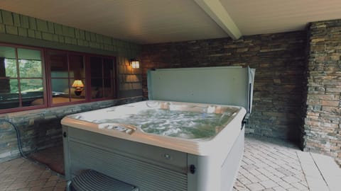 Covered Hot Tub easily accessed from downstairs.