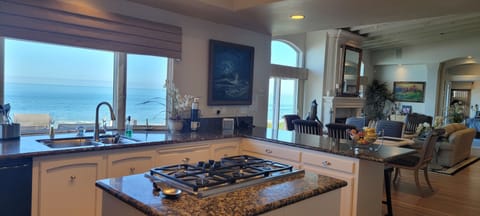 Gourmet Kitchen with Center Island, Stainless Appliances & Ocean View