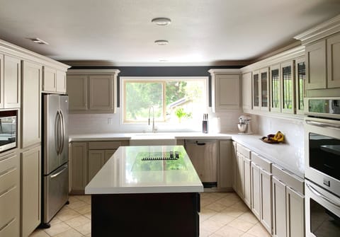2020 remodelled kitchen with granite countertop and glass cook top.