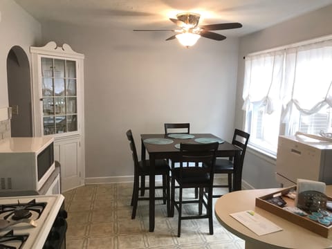 Dining area with seating for four guests.