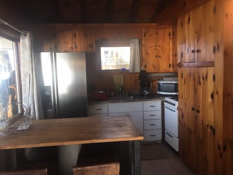 Fully stocked kitchen has all the wares one needs.