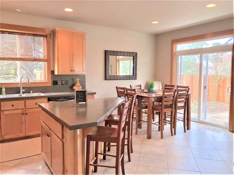 Large Kitchen Island With Seating Next to the Dining Area