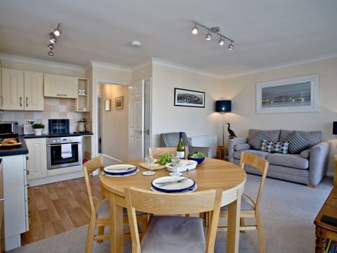 Wonderful dining area and adjacent kitchen | Top Deck - Linden Court, Brixham