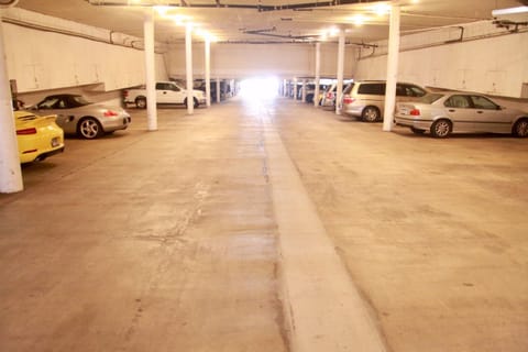 Gated, coded, secure garage will keep your car safe, and coo-ol. Two spaces.