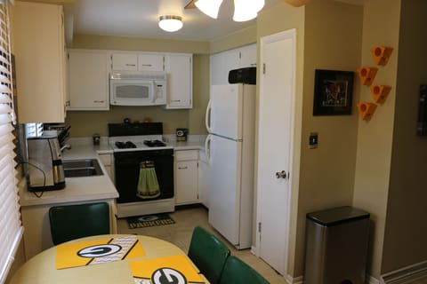 Kitchen w griddle, coffee maker, toaster, dishes utensils, pots and pans