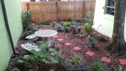 Backyard with Antique Patio Table and Benches