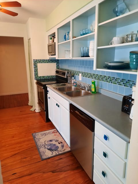 Kitchen View with Hardwood floors and Decorative Tile