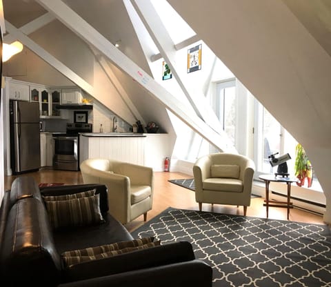 Original beams in sun filled large open concept Studio.