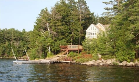 View of cottage and docks from the lake