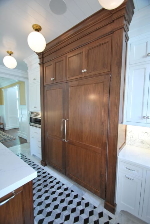 Walnut encased commercial grade freezer and refrigerator.  