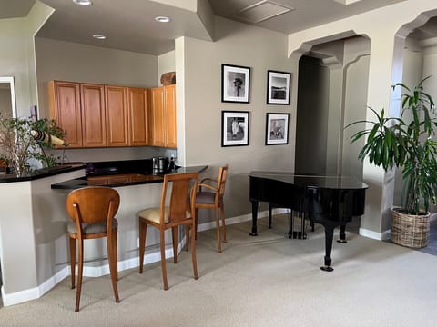 Bar Seating area with Mini Grand Piano
