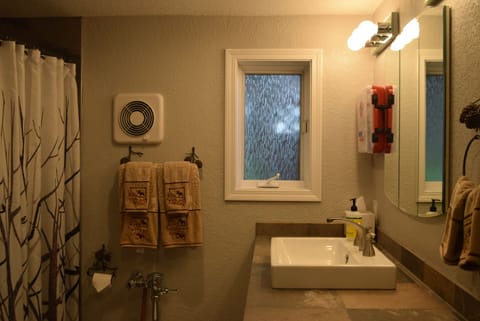 Bright, fully stocked bathroom provides all the comforts of home away from home