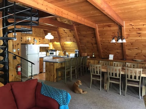 Main level has a wide open reading room, living room, eating area an kitchen.