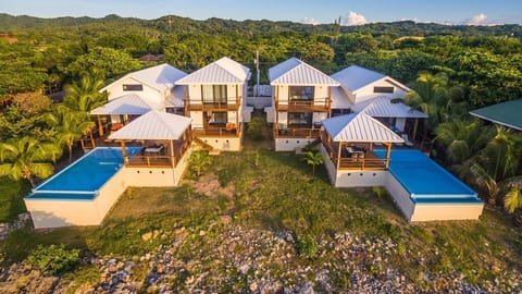 Even with a full house of 24 guests, the aerial layout shows multiple distinct zones—like the private balconies, the massive main deck, and separate living areas—ensuring it never feels crowded.