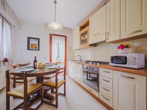 Cabinetry, Furniture, Property, Countertop, Table, Wood, Kitchen Stove, Lighting, Drawer, Interior Design