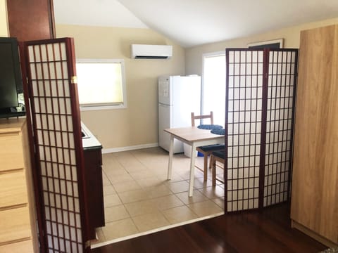 Full size refrigerator, dining table / work desk and AC to keep you cool or warm
