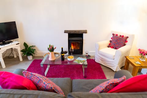 The living room with log burning stove for cosy nights in