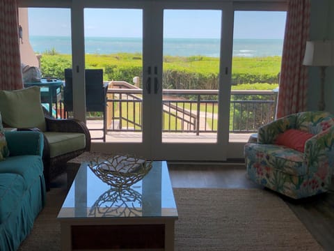 Living room looking out to deck and ocean 