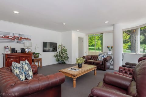 Spacious living room with park view