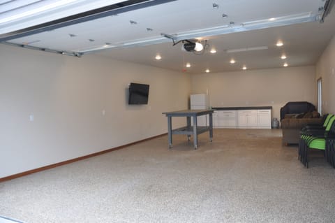Finished garage with 55" TV  Refrigerator and furniture!