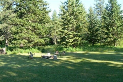 Firepit with a fully stocked wood pile