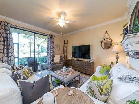 Living room with view of water and 11th hole on Golf Course. 