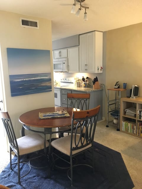 Dining area off kitchen. Photo shows old flooring. New photos coming soon