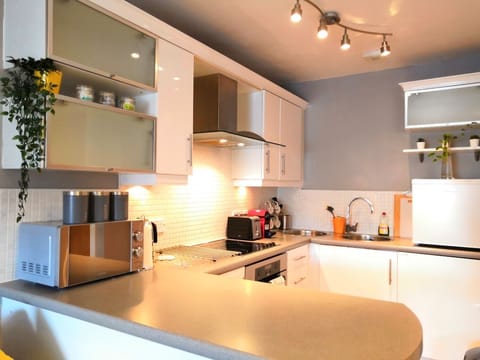 Kitchen equipped with hob, oven, microwave, coffee machine, fridge, freezer etc.