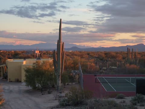 Casita, saguaro, our private tennis court, & sundown over our mountains