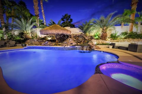 Tahiti Style Waterfall, Lounging under Palapa umbrella, Salt Water Pool and Spa
