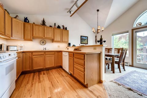 Open floorplan in kitchen looking out to living room and dining area