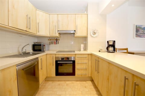 Half-open kitchen is fully fitted with all the appliances