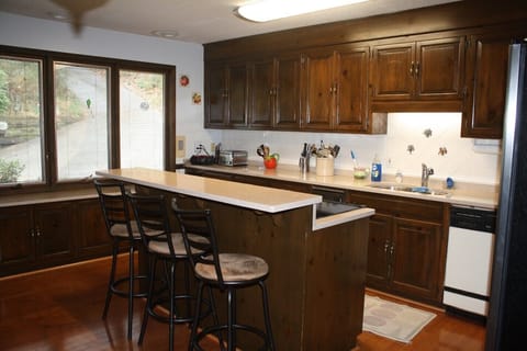 Island stove, 3 bar seats, lots of counter space.