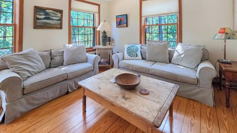 Living room with comfortable seating and large flat screen TV