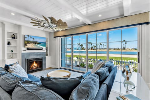 Relax by the fireplace while enjoying panoramic Mission Bay views